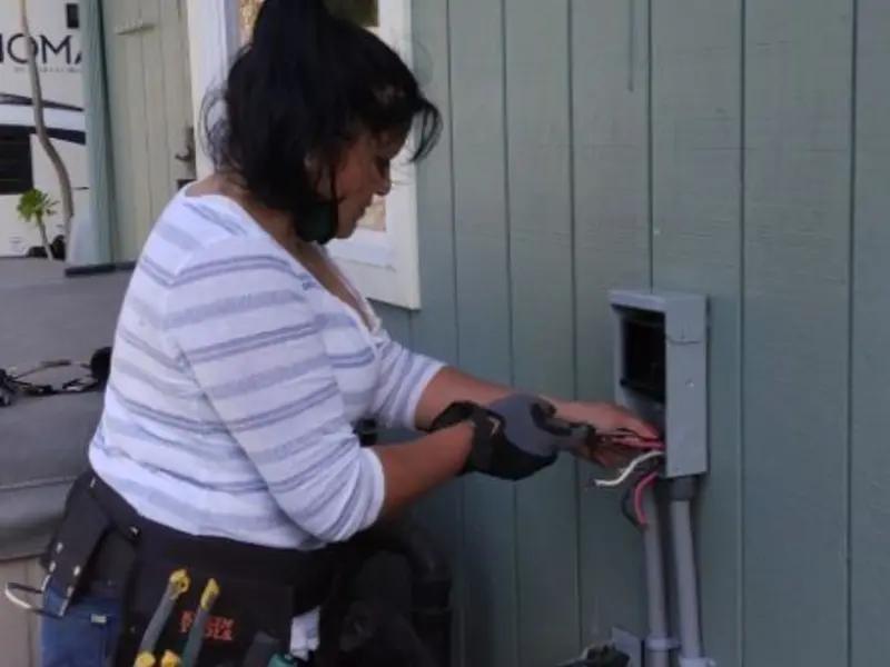 Licensed electrician wiring an exterior subpanel in Clearlake Riviera